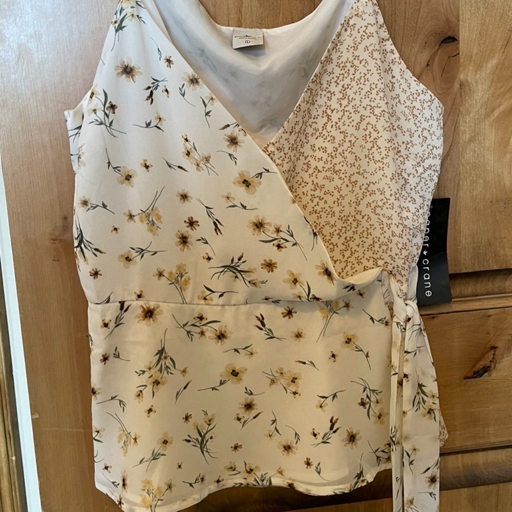This is a lovely paper crane tank top! Size large. Never worn tag still on!
